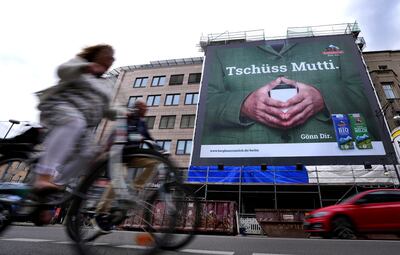 'Goodbye Mutti': A poster in Berlin salutes outgoing Chancellor Angela Merkel and her signature hand gesture. AP 
