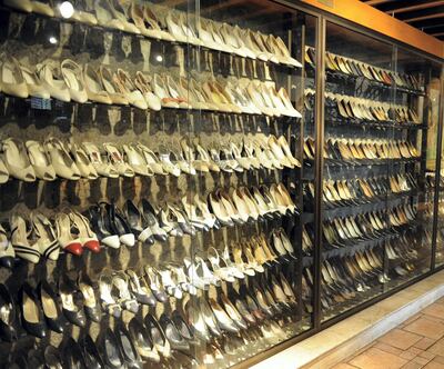 Hundreds of shoes of former Philippine first lady Imelda Marcos, are displayed at the shoe museum in Manila on September 26, 2012.  According to press reports, quoting national museum officials, shoes of former first lady Imelda Marcos, being kept at the national museum, which were left behind when the Marcos family fled the country in 1986 during a popular revolt, have been damaged by termites, and floods. AFP PHOTO / TED ALJIBE (Photo by TED ALJIBE / AFP)