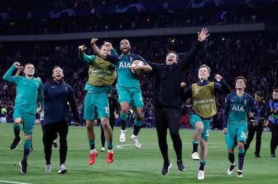 Tottenham's Brazilian forward Lucas (C) celebrates the victory with teammates at the end of the UEFA Champions League semi-final second leg football match between Ajax Amsterdam and Tottenham Hotspur at the Johan Cruyff Arena, in Amsterdam, on May 8, 2019. Tottenham fought back from three goals down on aggregate to stun Ajax 3-2 and set up a Champions League final against Liverpool. / AFP / Adrian DENNIS
