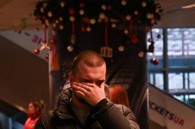 A relative of passengers and crew members of the crashed Ukraine International Airlines Flight PS752 reacts at the Boryspil airport outside Kiev on January 8, 2020. All passengers and crew on board the Ukrainian Boeing 737 plane that crashed shortly after take-off from Tehran on January 8, 2020 were killed, Ukrainian President Volodymyr Zelensky said. / AFP / Sergei Supinsky
