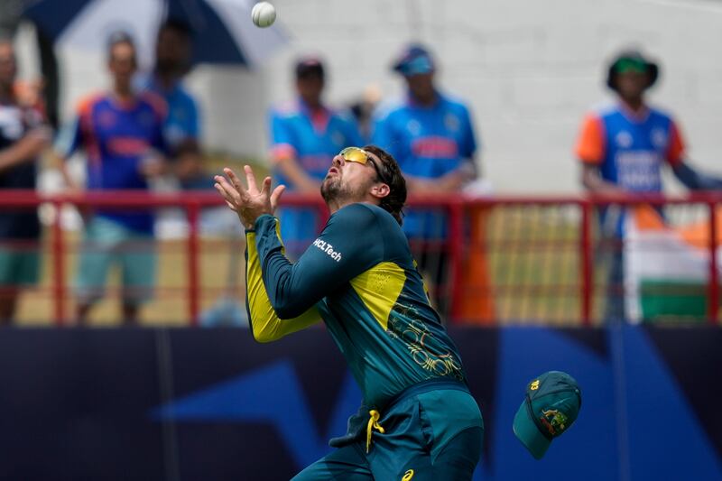 Australia's Tim David takes a catch to dismiss India's Virat Kohli. AP
