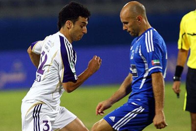 Ignacio Scocco, left, had chances for Al Ain but failed to convert. Mark Bresciano, right, did not miss his opportunity for Al Nasr.