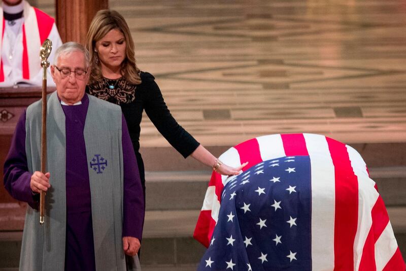 Jenna Bush Hager touches the casket during the State Funeral for her grandfather. AFP