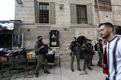 Israeli police officers keep watch as Muslim worshippers make their way to the Al Aqsa mosque. EPA