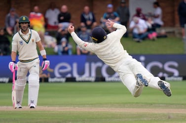 England's Ollie Pope takes the catch to dismiss Rassie van der Dussen of South Africa, during day four of the third cricket test between South Africa and England in Port Elizabeth, South Africa, Sunday, Jan. 19, 2020. (AP Photo/Michael Sheehan)