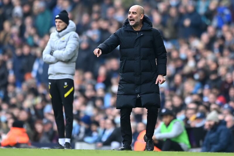 Manchester City manager Pep Guardiola issues instructions to his players as Chelsea manager Thomas Tuchel looks on. AP