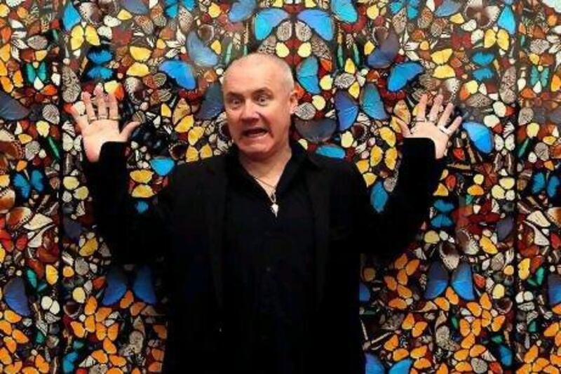 The British artist Damien Hirst poses in front of his painting The Importance of Elsewhere - The Kingdom of Heaven. Kerim Okten / EPA