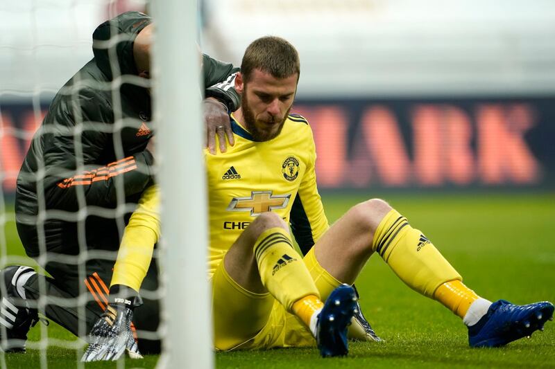 MANCHESTER UNITED RATINGS: David De Gea - 7: Stranded and looked despairing for opener, hurt shoulder saving from Saint Maximin. Stunning second half save from Callum Wilson. EPA