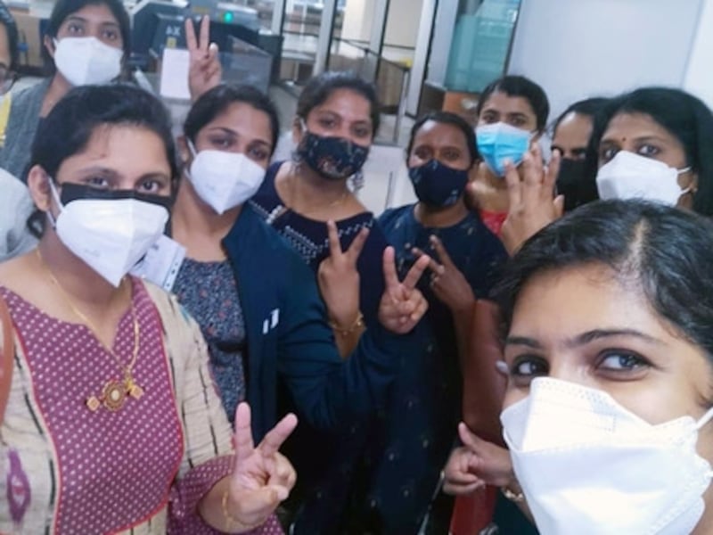 Doctors and nurses working for NMC Healthcare celebrate as they return to Sharjah from Kochi and Trivandrum in south-west India on two specially chartered Air Arabia services. Many more will soon follow as travel rules are eased.