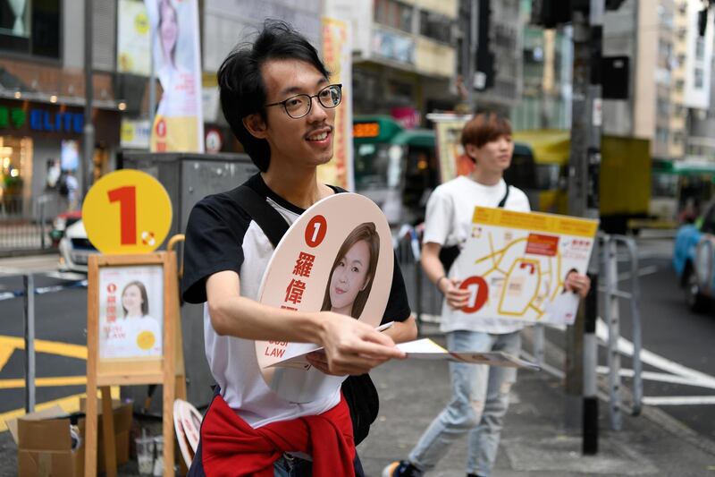 People campaign for Susi Law, a candidate in Sunday’s district council elections in Hong Kong, China November 23, 2019. REUTERS/Laurel Chor