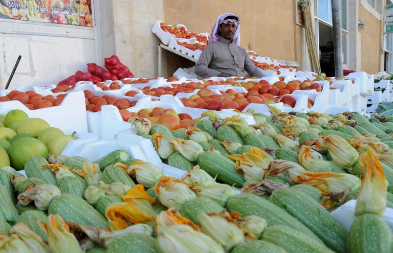 A Saudi vendor rests as he sells vegetables at a shop in Tabuk, 1500 km (932 miles) from Riyadh November 30, 2013. Saudi Arabia's crackdown on foreign workers has thrown millions of lives into turmoil and caused rioting in big cities, but the economy should benefit in the long run as Saudi nationals fill the gaps and cut their dependence on the state. REUTERS/Mohamed Alhwaity (SAUDI ARABIA - Tags: BUSINESS SOCIETY AGRICULTURE FOOD) - GM1E9C1084501