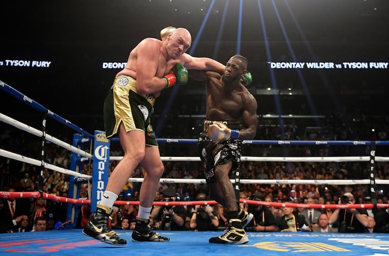 Deontay Wilder connects with Tyson Fury. AP Photo