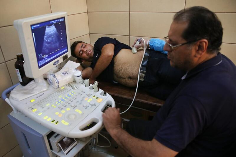 Sajjad Ghanbari undergoes a medical exam as part of the process of selling his kidney, in a clinic in downtown Tehran. Ebrahim Noroozi/AP Photo