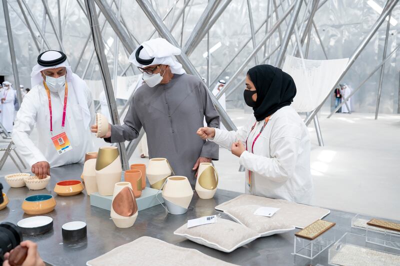 Sheikh Mohamed tours the pavilion, which was designed under the theme 'Density Weaves Opportunity'.