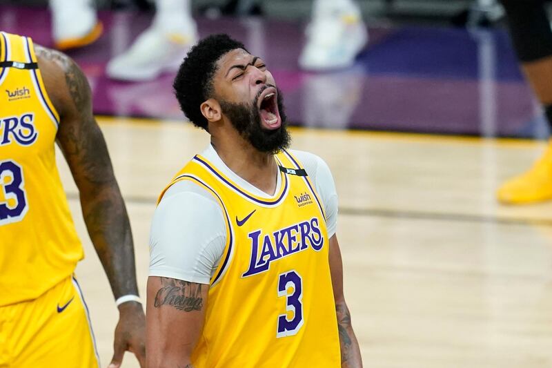 Los Angeles Lakers forward Anthony Davis shouts as he celebrates a stop against the Phoenix Suns during the second half of Game 2 of an NBA basketball first-round playoff series Tuesday, May 25, 2021, in Phoenix. The Lakers defeated the Suns 109-102. (AP Photo/Ross D. Franklin)