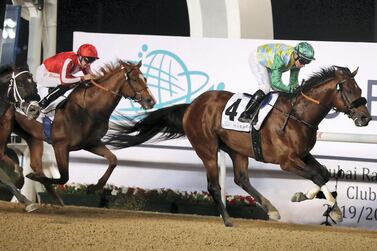 Tadhg O’Shea rides Secret Ambition to victory in the Dubai Creek Mile at the Meydan Racecourse. Pawan Singh / The National