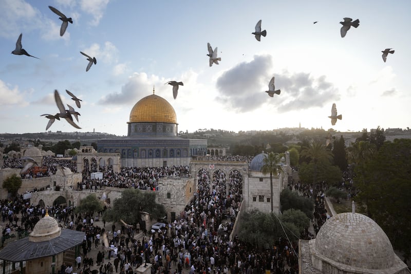 Palestinians attend Eid Al Fitr celebrations by the Dome of the Rock, in the Al Aqsa Mosque compound in Jerusalem on April 21, 2023.  AP