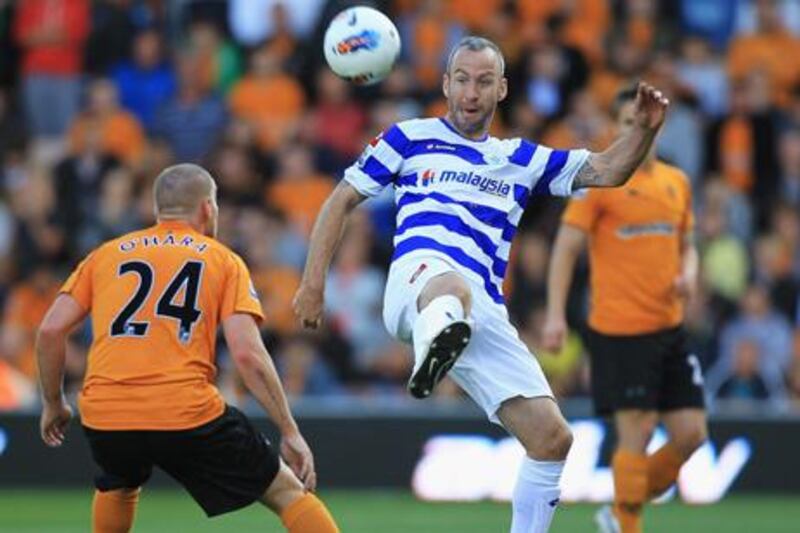 WOLVERHAMPTON, ENGLAND - SEPTEMBER 17:  Shaun Derry of Queens Park Rangers and Jamie O'Hara of Wolverhampton challenge for the ball during the Barclays Premier League match between Wolverhampton Wanderers and Queens Park Rangers at Molineux on September 17, 2011 in Wolverhampton, England.  (Photo by Matthew Lewis/Getty Images)