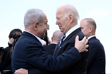 Israeli Prime Minister Benjamin Netanyahu greets US President Joe Biden in Tel Aviv in October last year. Mr Biden has faced criticism as the US continues to send military aid to Israel. AFP