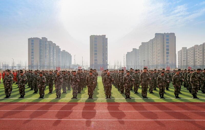 Soldiers attend a mourning service for the victims of a chemical plant explosion in Xiangshui county of Yancheng city in Jiangsu province, China. EPA