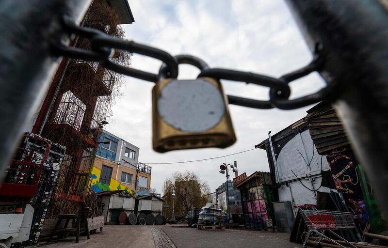 A locked gate blocks access to a bar area in Berlin. Germany's government has put a lid on New Year celebrations, with nightclubs slated to close from December 28 onwards. AFP