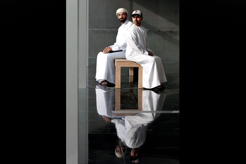 Thikrayat iPhone app creators, Faisal Jassim (right) and Thani al Shafar, pose for a portrait at the Pavilion in downtown Dubai.  Silvia Razgova / The National