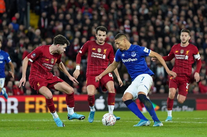 Everton's Richarlison, right, tries to dribble past Liverpool's Neco Williams at Anfield on Sunday. AP