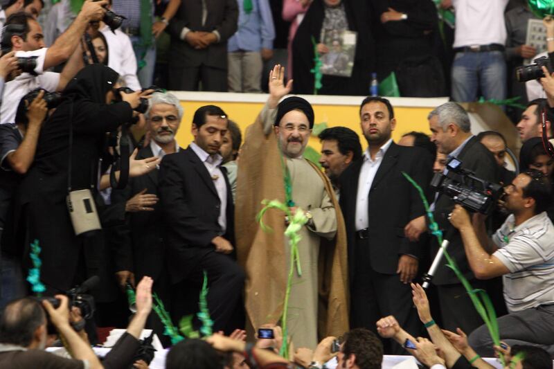 Tehrani youth , attending an election rally headed by ex-President Mohammad Khatami's who gave a speech in the 12,000 occupancy Azadi Stadium, supporting Mir-Hossein Moussavi in his presidential campaign. Over 20.000 people attended the event where supporters of Mousavi waved with green flags and balloons. The Presidential candidate's campaign team uses the color green, which stands for Islam and refers to Mousavi's title of ' seyed', desendent of the prohpet.