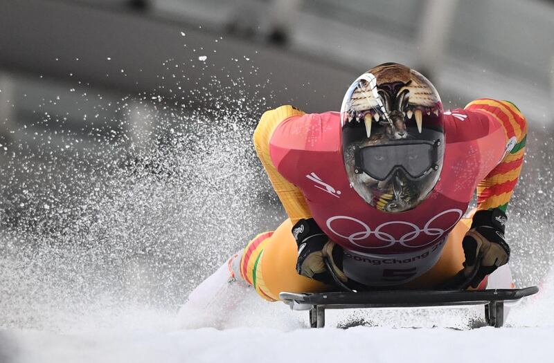 Ghana's Akwasi Frimpong slows down at the end of the mens' skeleton heat 1 during the Pyeongchang 2018 Winter Olympic Games. Mark Ralston / AFP