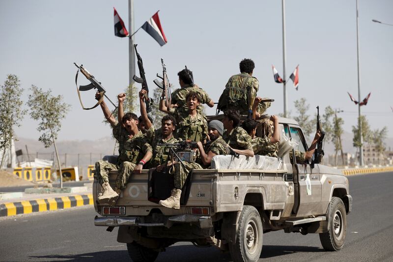 Houthi militants ride on the back of a patrol truck at the site of a gathering in Yemen's capital in December, 2015. Reuters