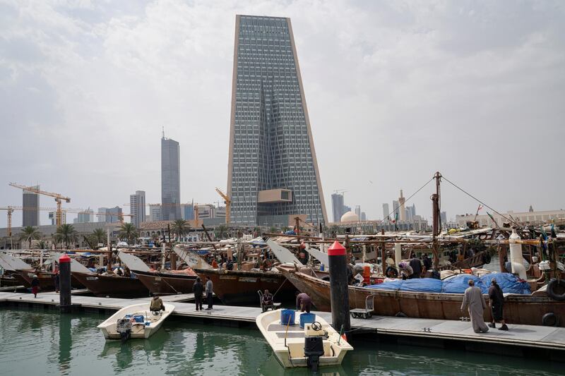 The Kuwait Central Bank towers are pictured over the traditional Dhow harbor as business deals and institutional lending for Gulf have frozen, following an outbreak of coronavirus disease (COVID-19), in Kuwait City, Kuwait March 18, 2020. REUTERS/Stephanie McGehee