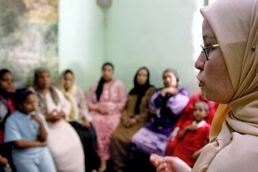 A counsellor tres to convince women they should not have female genital mutilation performed on their daughters in Minia, Egypt, in June 2006. Reuters