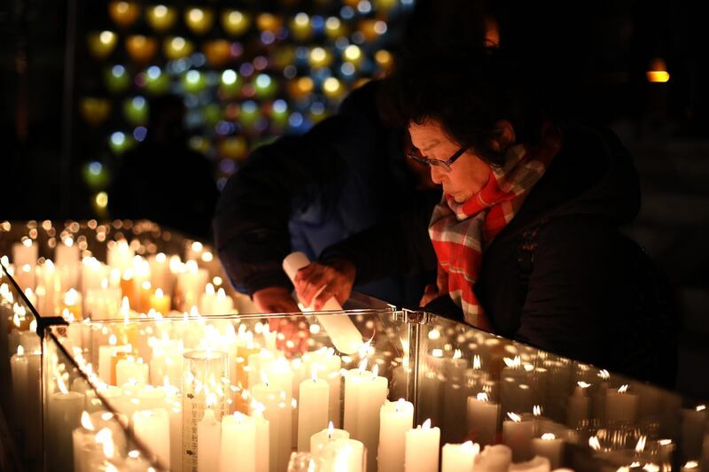 Buddhists light candles during New Year celebrations at Jogyesa Buddhist temple on January 1, 2019 in Seoul, South Korea. Getty Images