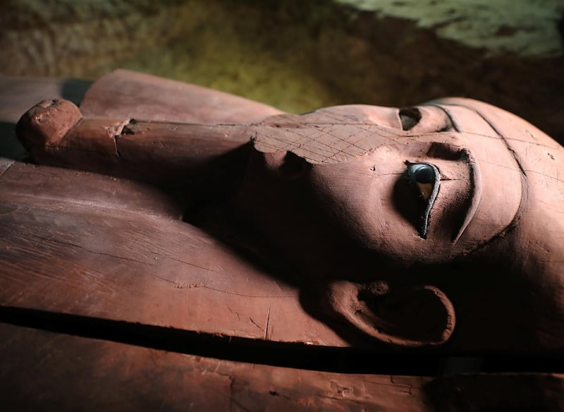 A wooden coffin inside the recently discovered burial site in Minya, Egypt. Mohamed Abd El Ghany / Reuters