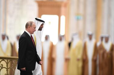 Russian President Vladimir Putin is received by Sheikh Mohamed bin Zayed during an official welcoming in Abu Dhabi. AFP