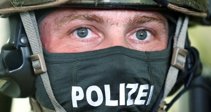 FILE PHOTO: A member of the GSG 9 unit of Bundespolizei, Germany's federal police, is pictured during the opening of a new headquarters for special forces and anti-terror units in Berlin, Germany August 8, 2017. REUTERS/Hannibal Hanschke/File Photo