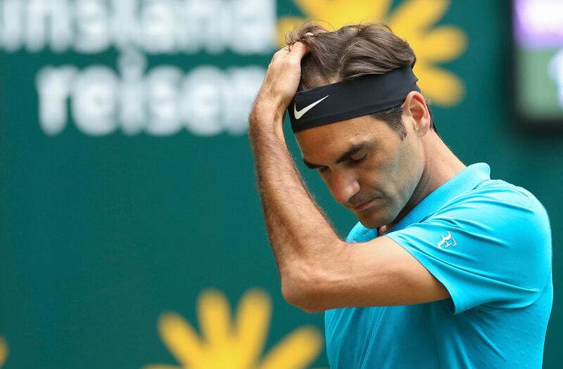 Roger Federer reacts during the final match against Boran Coric at the Gerry Weber Open ATP tennis tournament in Halle, Germany, Sunday, June 24, 2018. (Friso Gentsch/dpa via AP)