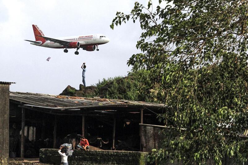 An Air India aircraft prepares to land at the airport in Mumbai. The airline posted a net loss of 55 billion rupees in the financial year to the end of March this year. Dhiraj Singh / Bloomberg