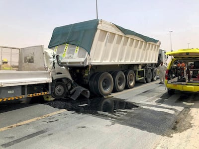 The cab of the truck is crushed, trapping the motorists. Courtesy UAQ Civil Defence