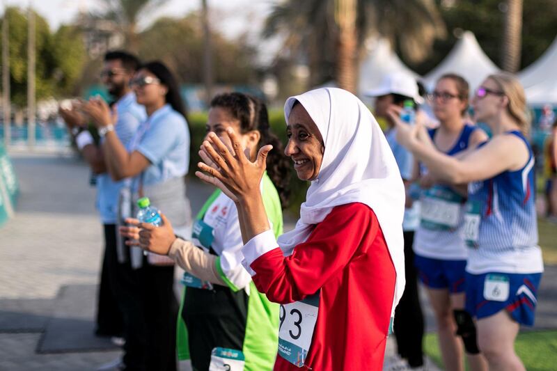 DUBAI, UNITED ARAB EMIRATES - March 16 2019.
Teammates cheering their team athlete runners at Special Olympics World Games athletics competition in Dubai Police Academy Stadium.

 (Photo by Reem Mohammed/The National)

Reporter: 
Section:  NA