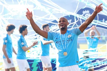 Vincent Kompany celebrates after Manchester City won the Premier League title following their match against Brighton & Hove Albion in Brighton in May. Man City via Getty Images
