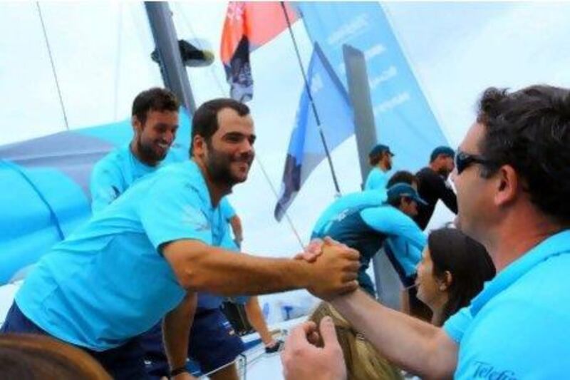 Crew of the Spanish boat Telefonica get a welcoming reception on arrival in Sanya, southern China's Hainan province today, with a handsome 90-minute victory to claim a hat-trick triumph in the leg from Abu Dhabi.