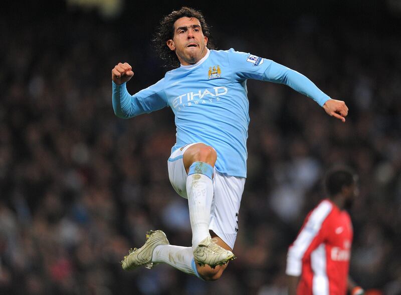 Manchester City's Argentinian forward Carlos Tevez celebrares after opening the score during the Carling Cup quarter final football match  against Arsenal at The City of Manchester stadium, Manchester,  north-west England on December 2, 2009. AFP PHOTO/ANDREW YATES.  FOR  EDITORIAL USE Additional licence required for any commercial/promotional use or use on TV or internet (except identical online version of newspaper) of Premier League/Football League photos. Tel DataCo +44 207 2981656. Do not alter/modify photo *** Local Caption ***  366395-01-08.jpg