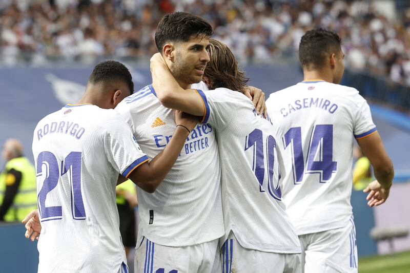 Asensio celebrates with his teammates. EPA