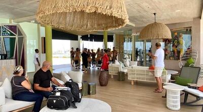 Guests wait to check in at the Hard Rock Hotel Maldives. Courtesy Crossroads Maldives 