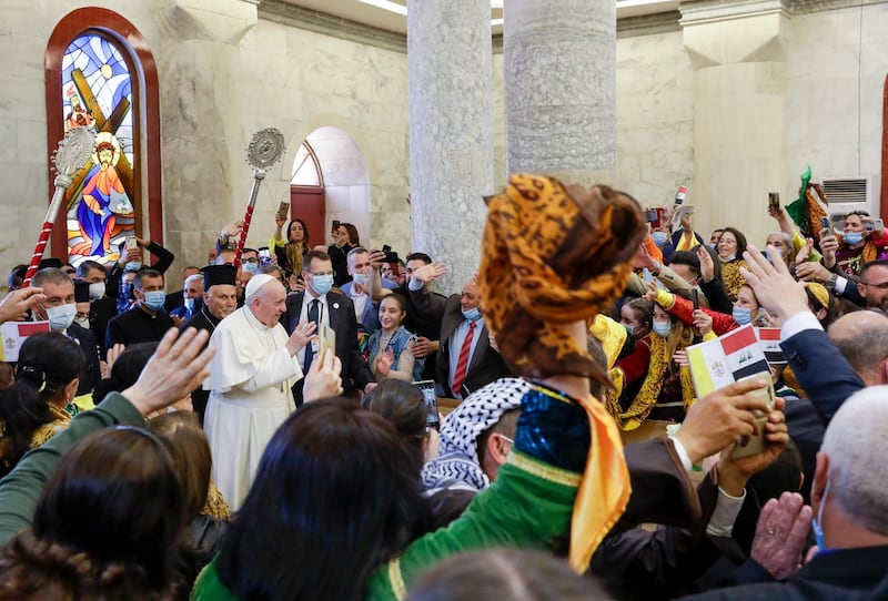 Pope Francis arrives at a meeting with local residents at the Church of the Immaculate Conception in Qaraqosh. AP Photo