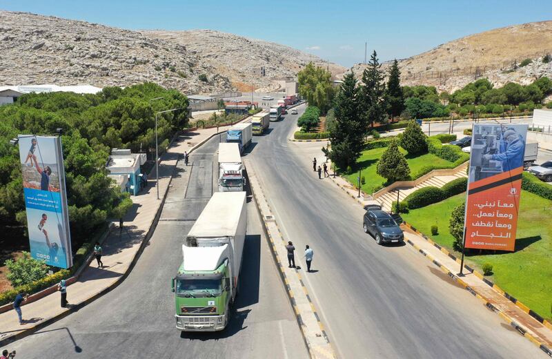 This aerial view shows trucks from a United Nations aid convoy entering Syria through the Bab Al Hawa border crossing with Turkey, carrying basic vital necessities for the inhabitants of the northwestern rebel-held areas on the country, on July 28, 2022. File photo / AFP