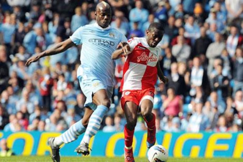 Mario Balotelli, left, has been hailed as the best Italian striker by Roberto Mancini. Peter Powell / EPA