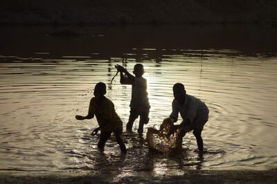 Children play in the Gash River, a seasonal lifeline that people rely on for agriculture and drinking, as it begins its flow through Kassala State, some 600 kilometres from the Sudanese capital Khartoum. AFP
