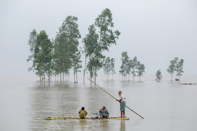 People transporting fresh water in a banana boat during flooding in the Kajla area at Bogra, Bangladesh 16 August 2017. Peoples suffering continues as many of them left their homes along with their cattle, goats, hens and other pets and took shelter in safe areas and many of these people have still not been able to return as the water has not fully receded from their homes. Flood-related incidents in Dinajpur, Gaibandha and Lalmonirhat has seen the death toll rise to 30 in the last three days across the country.